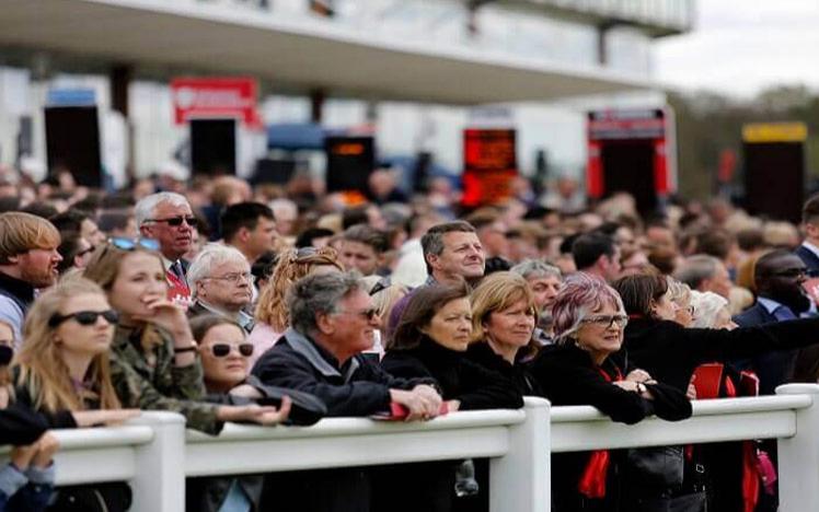 Crowds watching racing.