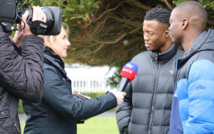 Two teenagers being interviewed at Lingfield Park.