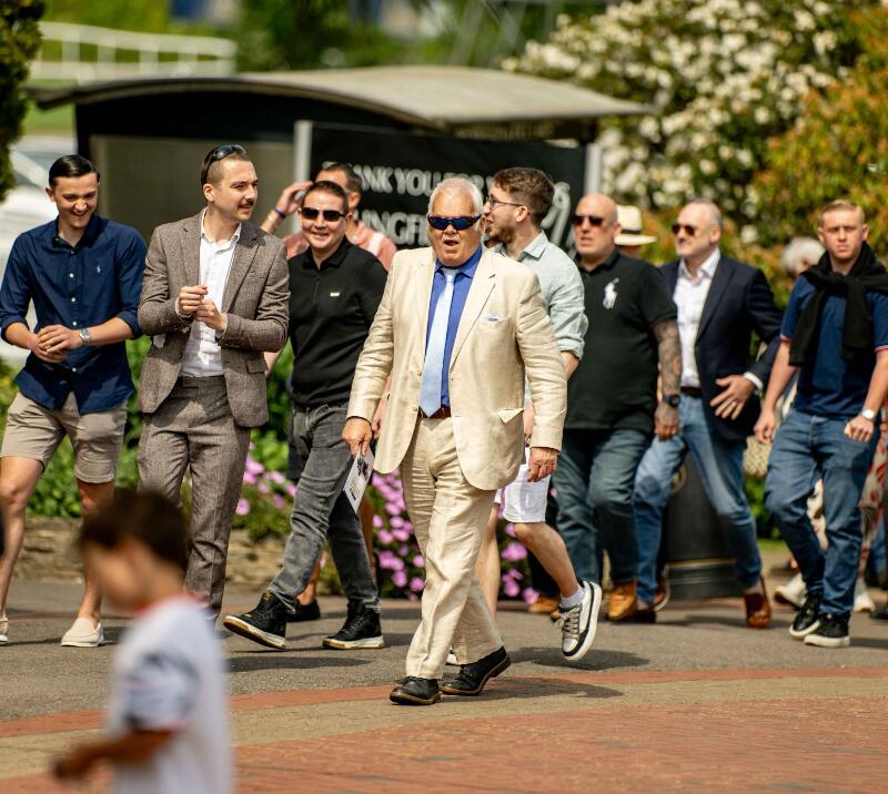 A group of gents in suits at Lingfield Racecourse