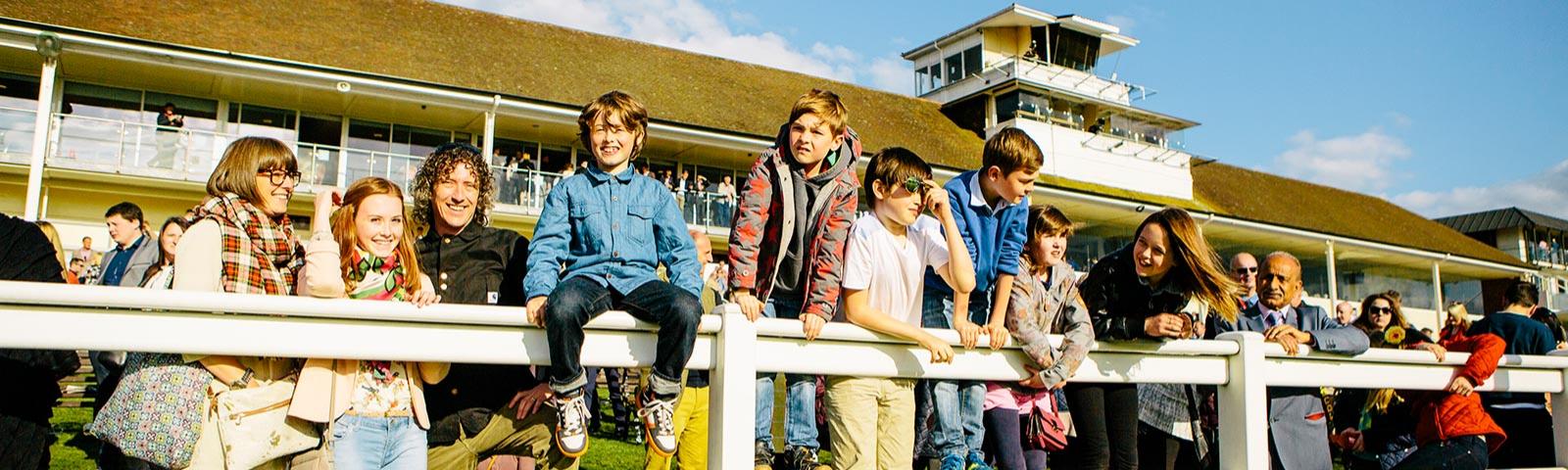 children waiting for horse racing