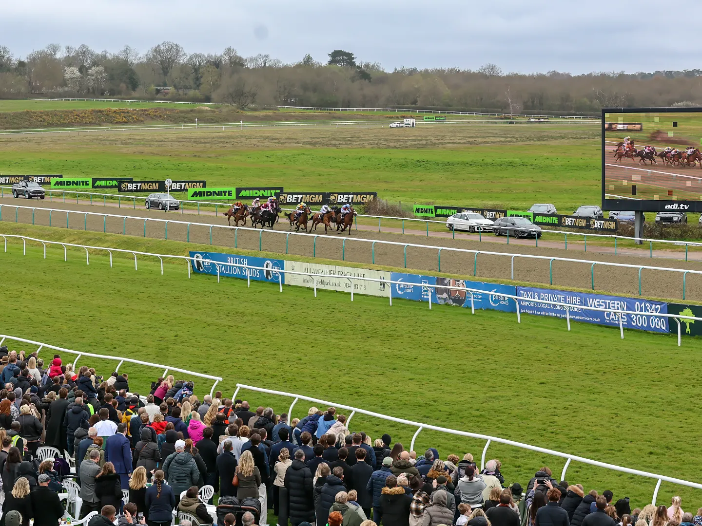 Horses and jockeys competing in the Vase All Weather Championship at Lingfield Park