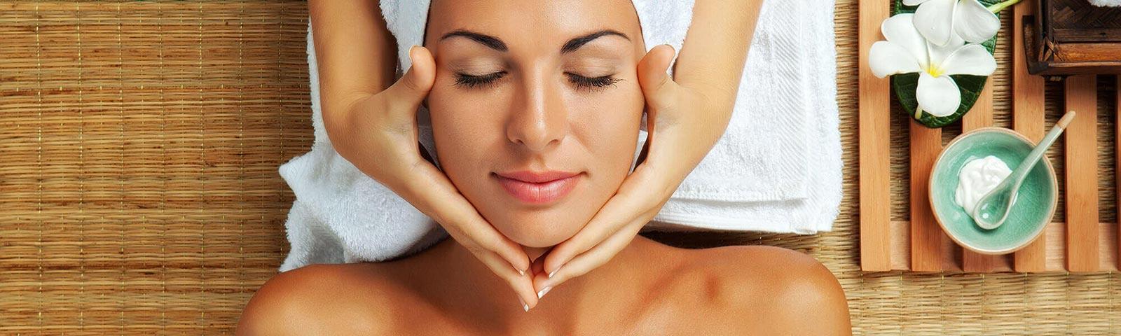 Woman receiving a massage while relaxing in the spa.
