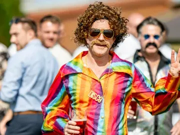 man dressed in 70s disco