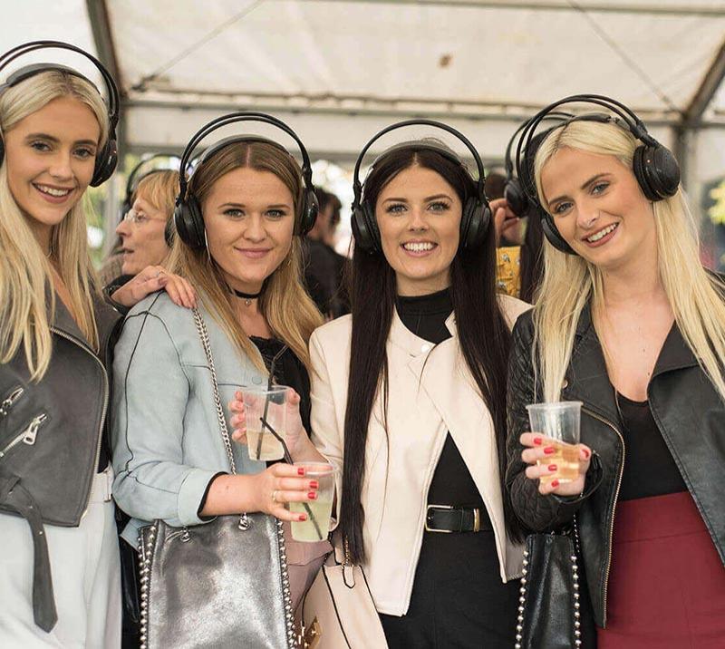 Ladies wearing headphones.