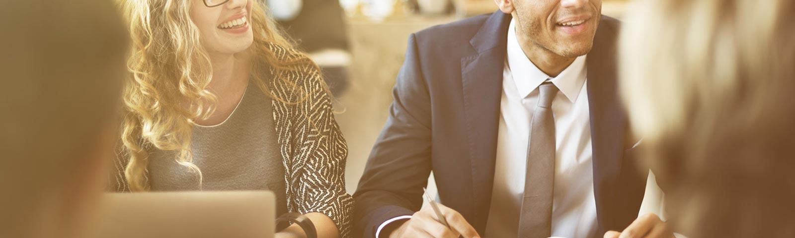 Colleagues discuss the days schedule.