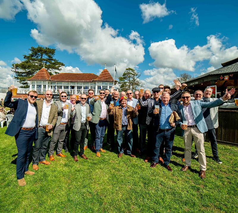 Excited crowd posing in the sunshine.