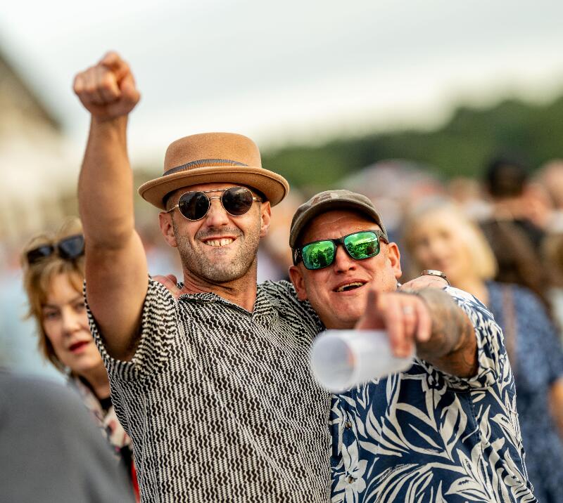 Two guests at Lingfield Park enjoying a music night