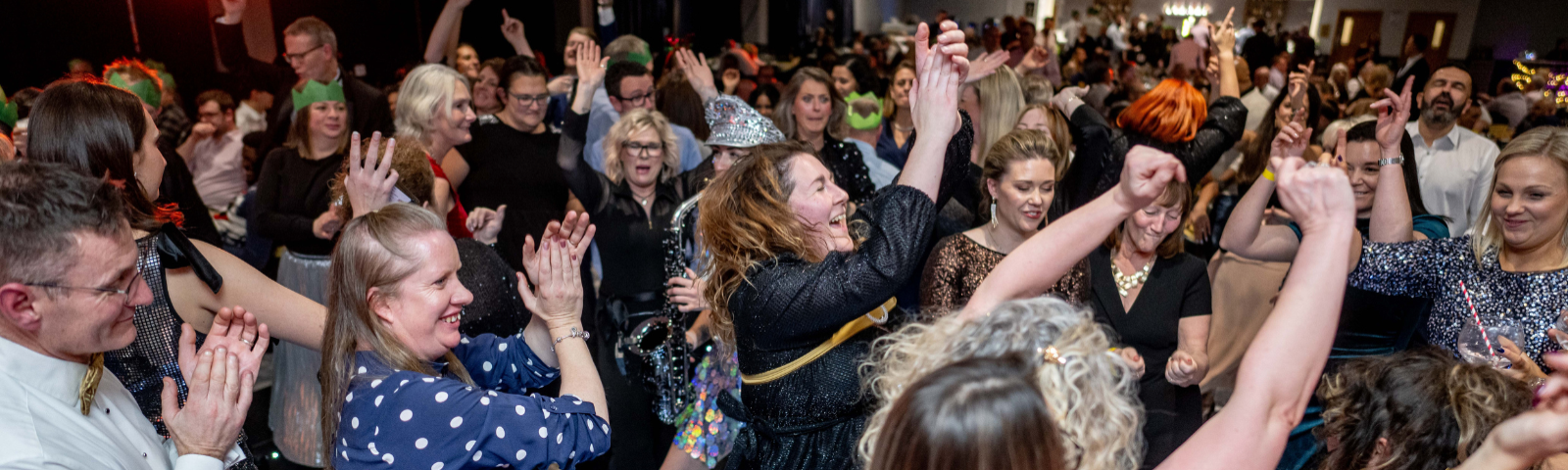 People dancing and having fun at Lingfield Park's Christmas Parties.